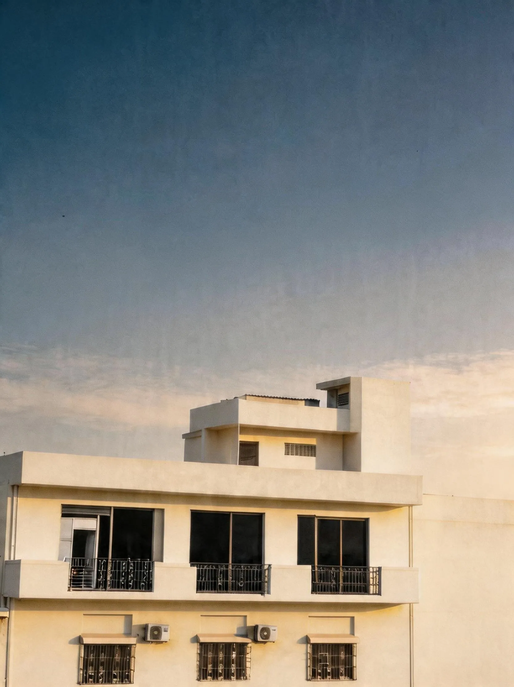 Apex Corporation knitted garment manufacturing factory exterior front view located in North Karachi Industrial Area Pakistan established 1984